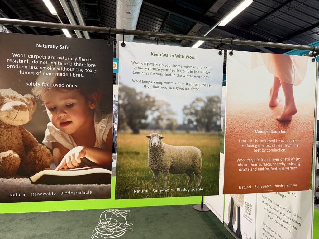 Sustainability display at The Flooring Show 2025 highlighting wool carpets as a natural flooring trend, showcasing benefits like safety, warmth, comfort, and eco-friendly design.