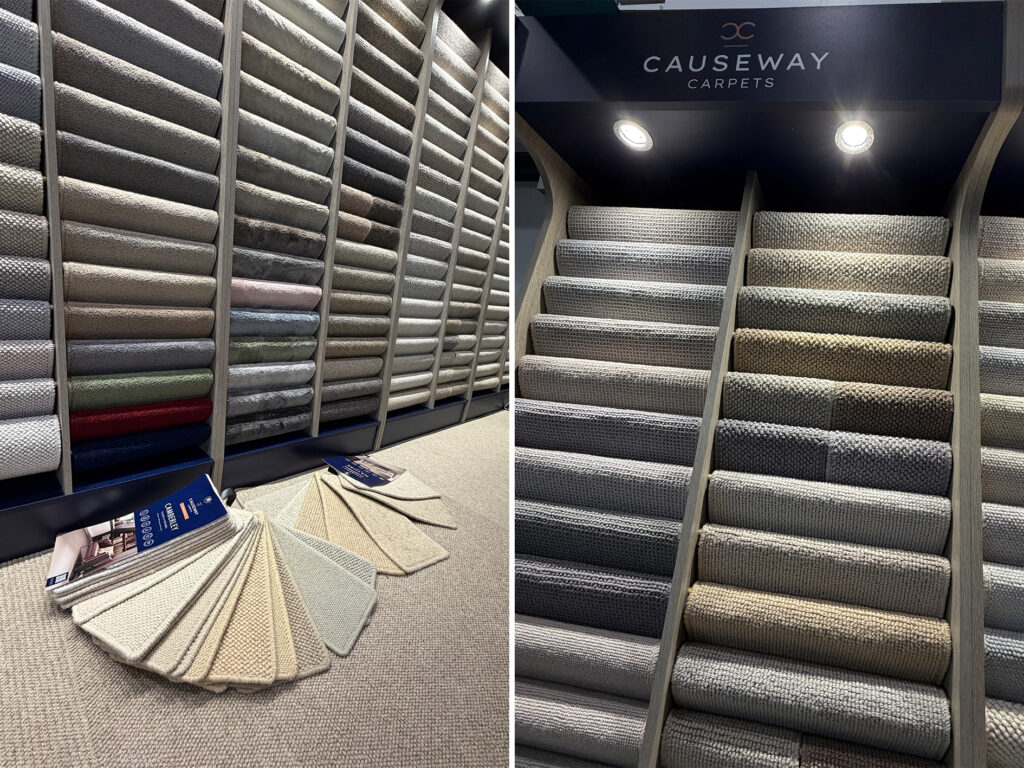 Carpet display walls and neutral sample swatches showcased at The Flooring Show South, featuring a wide range of textured flooring styles.