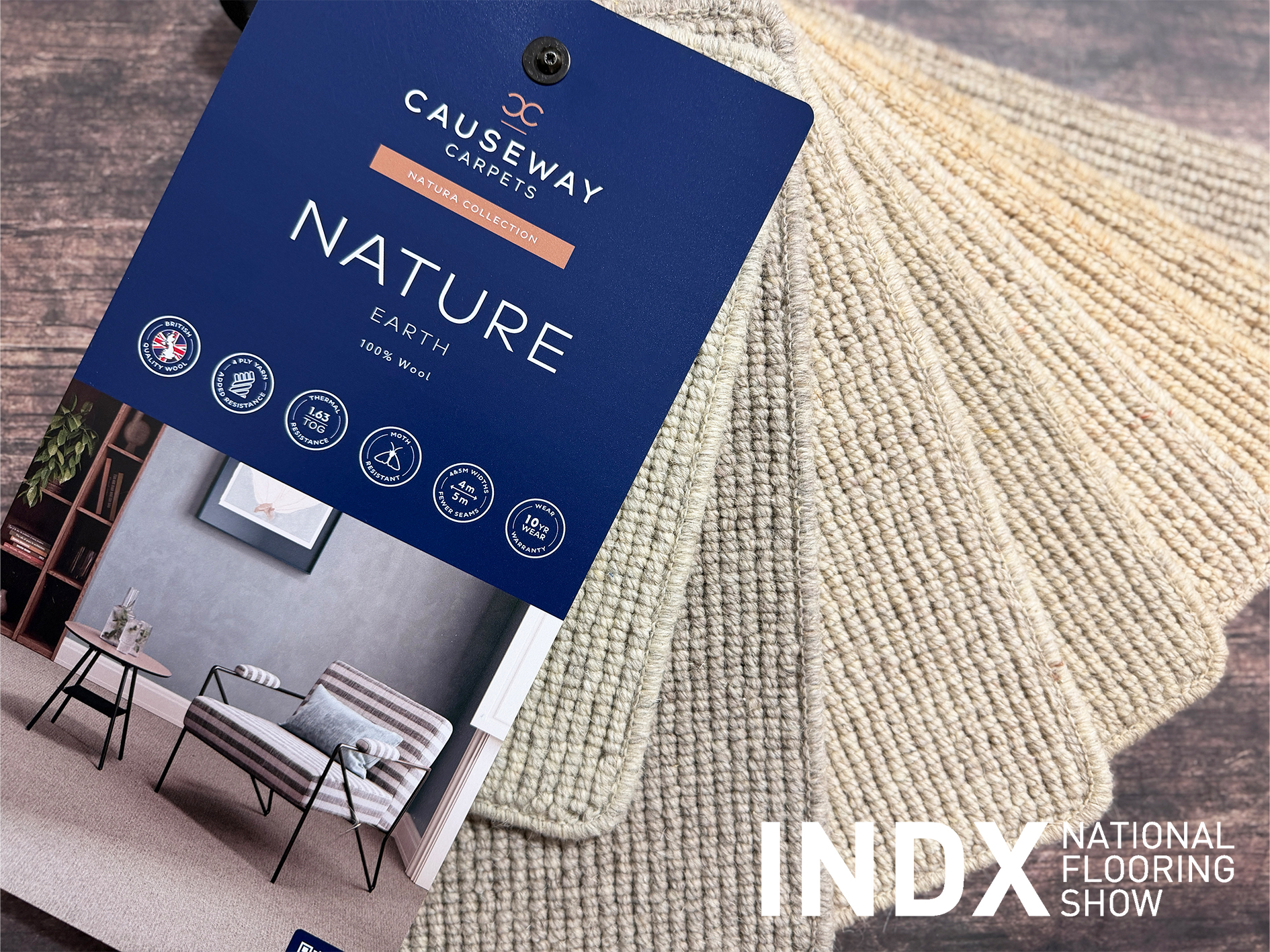 Causeway Carpets Natura Earth 100% wool carpet sample book with loop pile texture, showcased at INDX National Flooring Show