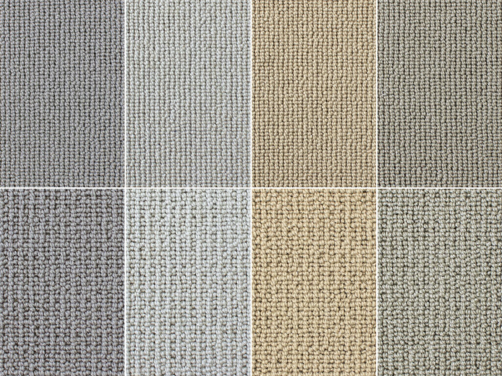 Luxury textured carpet samples in elegant neutral shades featuring premium woven loop pile finishes, showcasing high-end bespoke carpets for sophisticated interiors, luxury homes and contemporary flooring design projects.