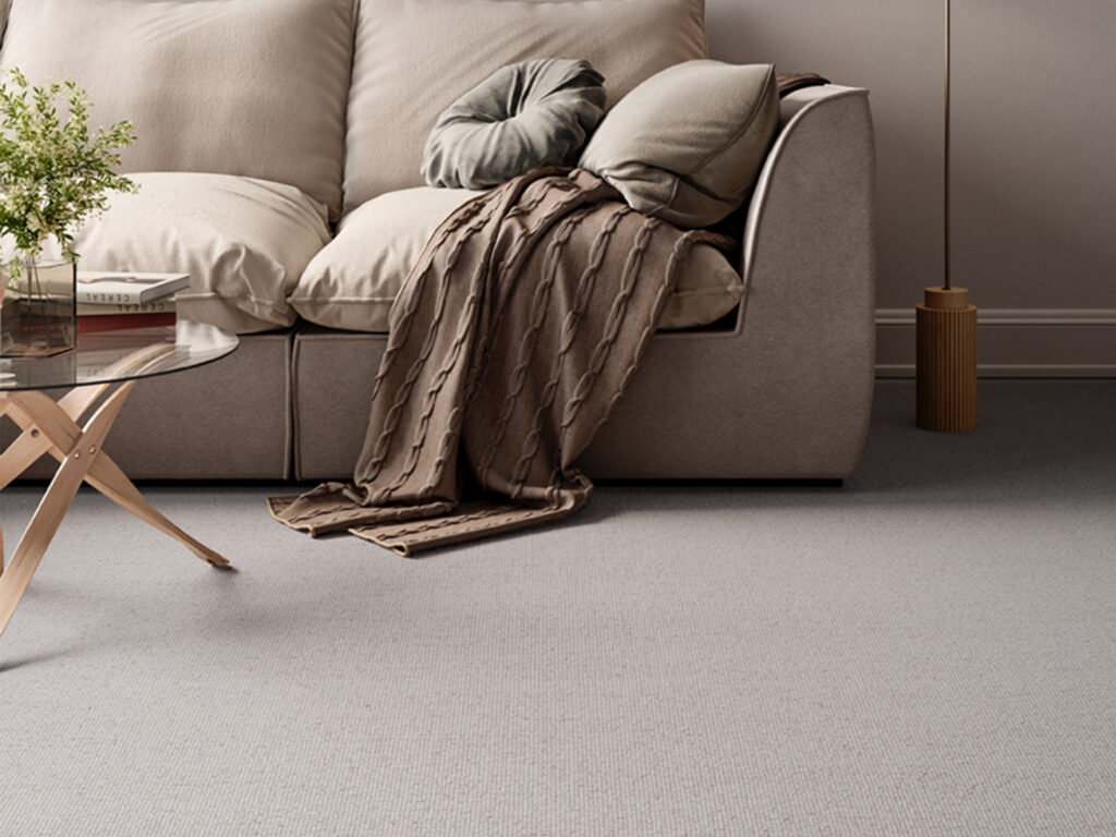 Elegant neutral living room with luxury soft-textured carpet, contemporary sofa and layered cushions, showcasing premium fitted carpeting for sophisticated homes, modern interiors and high-end residential flooring design.