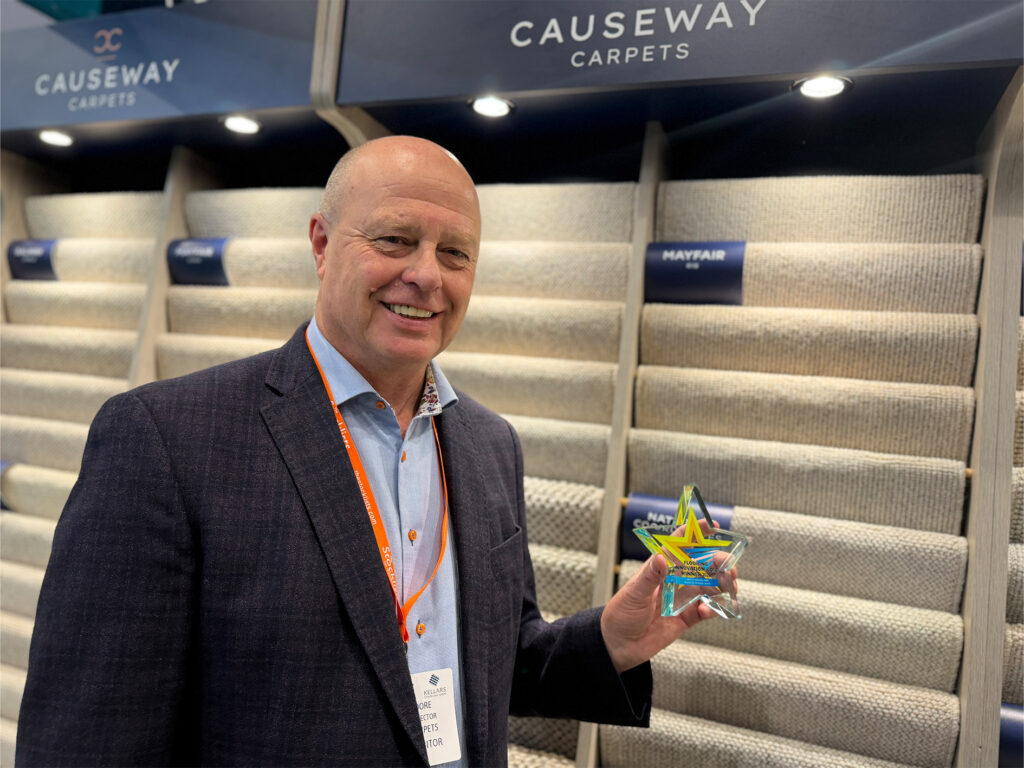 Causeway Carpets at The Flooring Show celebrating a Gold Flooring Innovation Award, with the award-winning Mayfair wool carpet collection on display.